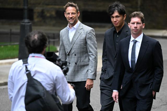 Former British F1 driver Jenson Button, Williams' Thai driver Alexander Albon (C), and William's British team principal James Vowles (R) arrives to attend a reception to celebrate 75 years of Formula 1 hosted by Britain's Prime Minister Keir Starmer at 10 Downing Street, in central London on July 2, 2025. (Photo by Ben STANSALL / AFP)