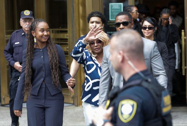 Janice Combs (C), mother of Sean "Diddy" Combs, waves as she departs alongside her grandchildren and family members at Manhattan's Federal Court after jury reached a full verdict in Sean "Diddy" Combs' sex trafficking trial on July 2, 2025, in New York City. Music mogul Sean "Diddy" Combs was found not guilty of racketeering and sex trafficking on Wednesday but convicted of a less serious prostitution charge after a high-profile seven week trial in New York. (Photo by Leonardo Munoz / AFP)
