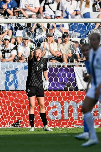 Iceland's goalkeeper #01 Cecilia Runarsdottir gives instructions to her teammates during the UEFA Women's Euro 2025 Group A football match between Iceland and Finland at the Arena Thun stadium in Thun on July 2, 2025.  (Photo by Fabrice COFFRINI / AFP)