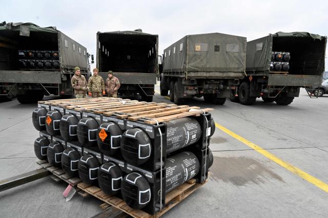 (FILES) Ukrainian servicemen are at work to receive the delivery of FGM-148 Javelins, American man-portable anti-tank missile provided by US to Ukraine as part of a military support, at Kyiv's airport Boryspil on February 11,2022, amid the crisis linked with the threat of Russia's invasion. Ukraine appealed to the United States for clarity on July 1, 2025, after it was caught off guard by a White House announcement that Washington was halting some arms shipments to the war-battered country. The White House had said that it was halting some key weapons shipments promised by the previous US administration, without elaborating. (Photo by Sergei SUPINSKY / AFP)