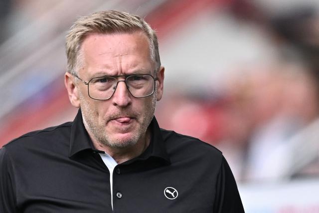 Iceland's coach Thorsteinn Halldorsson reacts during the UEFA Women's Euro 2025 Group A football match between Iceland and Finland at the Arena Thun stadium in Thun on July 2, 2025.  (Photo by Fabrice COFFRINI / AFP)