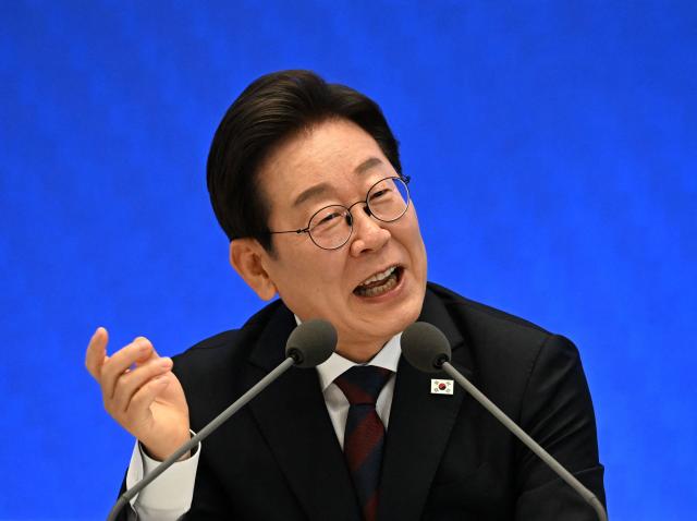 South Korean President Lee Jae Myung delivers a speech during a press conference to mark his first 30 days in office at the Blue House in Seoul on July 3, 2025. (Photo by KIM Min-Hee / POOL / AFP)
