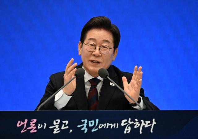 South Korean President Lee Jae Myung delivers a speech during a press conference to mark his first 30 days in office at the Blue House in Seoul on July 3, 2025. (Photo by KIM Min-Hee / POOL / AFP)