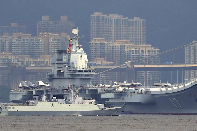 China's first domestically built aircraft carrier Shandong is anchored after arriving in Hong Kong on July 3, 2025. Commissioned in 2019, the 305-metre-long (1,000 feet) Shandong is China's second carrier and key to the country's regional ambitions under President Xi Jinping, who oversaw a massive naval buildup that has rattled Asian neighbours. (Photo by May JAMES / AFP)