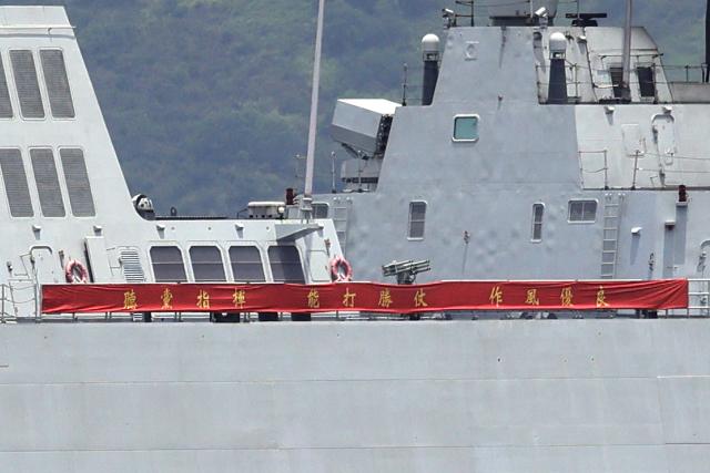 China's first domestically built aircraft carrier Shandong's escort destroyer Yanan diplays a banner that reads "Follow the Party's,  be capable of winning battles, maintain fine discipline and style" after it arrived in Hong Kong on July 3, 2025. Commissioned in 2019, the 305-metre-long (1,000 feet) Shandong is China's second carrier and key to the country's regional ambitions under President Xi Jinping, who oversaw a massive naval buildup that has rattled Asian neighbours. (Photo by May JAMES / AFP)
