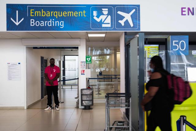 A passenger arrives at the boarding area in the regional terminal during a control operation against drug trafficking at the Maryse Conde airport, in Les Abymes, on the French Caribbean island of Guadeloupe on July 2, 2025. (Photo by Carla Bernhardt / AFP)