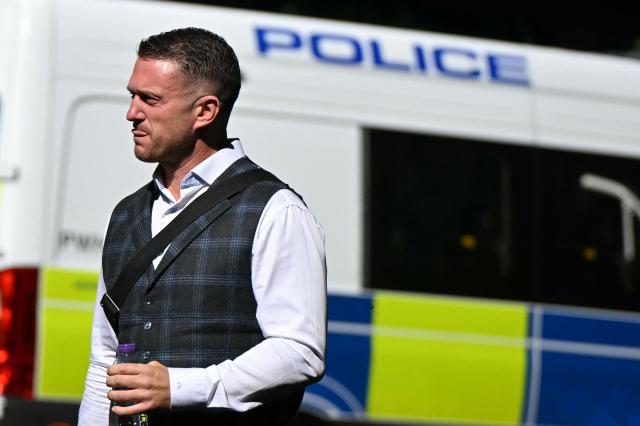 British far-right activist Tommy Robinson, whose real name is Stephen Yaxley-Lennon, arrives outside Southwark Crown court on July 3, 2025, charged with "harassment" of two journalists. (Photo by JUSTIN TALLIS / AFP)