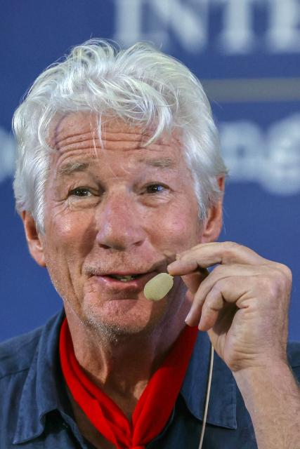 US actor Richard Gere addresses a gathering during the International Tibet Youth Forum in Dharamsala on July 3, 2025. The Dalai Lama said on July 2 that the 600-year-old Tibetan spiritual institution would continue after his death, reassuring Buddhist followers around the globe and saying his office "exclusively" would name his successor, even as China insisted it would. (Photo by Niharika KULKARNI / AFP)