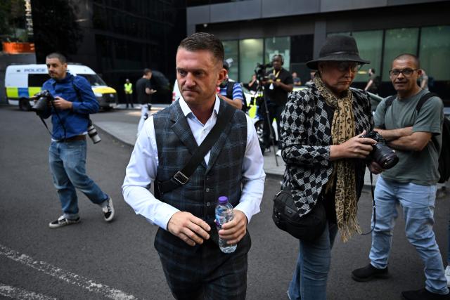 British far-right activist Tommy Robinson, whose real name is Stephen Yaxley-Lennon, arrives outside Southwark Crown court on July 3, 2025, charged with "harassment" of two journalists. (Photo by JUSTIN TALLIS / AFP)