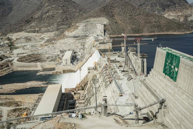 (FILES) This general view shows the Grand Ethiopian Renaissance Dam (GERD) in Guba, Ethiopia, on February 19, 2022. The Grand Ethiopian Renaissance Dam (GERD) is "now complete" announced Ethiopian Prime Minister Abiy Ahmed on July 3, 2025, a project that has been a source of tension with neighboring countries, particularly Egypt. (Photo by Amanuel SILESHI / AFP)