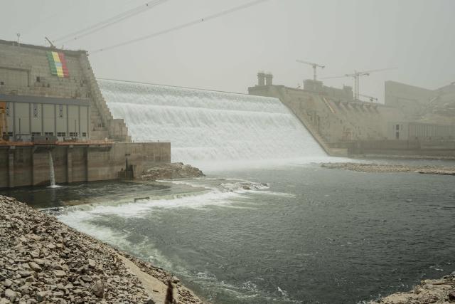 (FILES) A general view of the Grand Ethiopian Renaissance Dam (GERD) in Guba, Ethiopia, on February 20, 2022. The Grand Ethiopian Renaissance Dam (GERD) is "now complete" announced Ethiopian Prime Minister Abiy Ahmed on July 3, 2025, a project that has been a source of tension with neighboring countries, particularly Egypt. (Photo by Amanuel SILESHI / AFP)