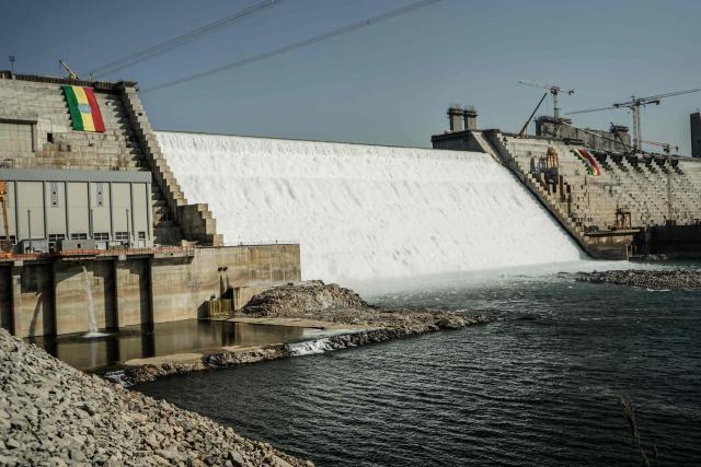 (FILES) This general view shows the site of the Grand Ethiopian Renaissance Dam (GERD) in Guba, Ethiopia, on February 19, 2022. The Grand Ethiopian Renaissance Dam (GERD) is "now complete" announced Ethiopian Prime Minister Abiy Ahmed on July 3, 2025, a project that has been a source of tension with neighboring countries, particularly Egypt. (Photo by Amanuel SILESHI / AFP)