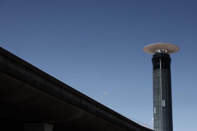 A picture taken on July 3, 2025 shows the air traffic control tower of Roissy Charles-de-Gaulle airport, outside Paris, as French air traffic controllers launched a two-day strike to demand better working conditions, disrupting travel for tens of thousands of people at the start of a summer holiday season. (Photo by Thibaud MORITZ / AFP)