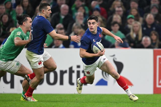 (FILES) France's scrum-half Nolann Le Garrec (R) runs with the ball during the Six Nations international rugby union match between France and Ireland at the Stade Velodrome in Marseille, south-eastern France, on February 2, 2024. La Rochelle's scrum-half Nolann Le Garrec will be paired with Bayonne's fly-half Joris Segonds, who will earn his first cap with the French XV, on July 5, 2025 against New Zealand, head coach Fabien Galthié announced on July 3, 2025. (Photo by NICOLAS TUCAT / AFP)