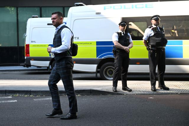 British far-right activist Tommy Robinson, whose real name is Stephen Yaxley-Lennon, arrives outside Southwark Crown court on July 3, 2025, charged with "harassment" of two journalists. (Photo by JUSTIN TALLIS / AFP)