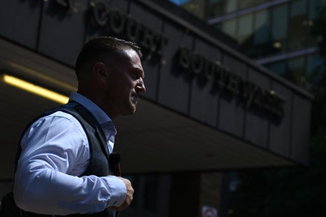 British far-right activist Tommy Robinson, whose real name is Stephen Yaxley-Lennon, leaves Southwark Crown court on July 3, 2025, charged with "harassment" of two journalists. (Photo by JUSTIN TALLIS / AFP)
