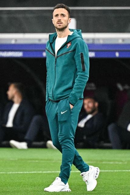 (FILES) Portugal's forward #21 Diogo Jota inspects the pitch before the UEFA Euro 2024 round of 16 football match between Portugal and Slovenia at the Frankfurt Arena in Frankfurt am Main on July 1, 2024. Liverpool striker Diogo Jota died along with his brother early July 3, 2025 in a road accident in northwest Spain, the Spanish Civil Guard said. The accident occurred around 12:30 a.m. on a highway in the province of Zamora. The vehicle "left the road" before bursting into flames, the Civil Guard said, adding that the two passengers, Diogo Jota and his brother Andre Felipe, also a professional footballer, were deceased. (Photo by JAVIER SORIANO / AFP)