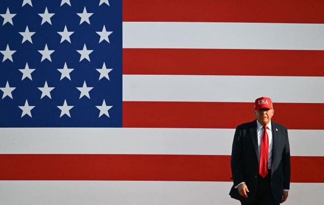 US President Donald Trump steps on stage to deliver remarks at the Salute to America Celebration at the Iowa State Fairgrounds in Des Moines on July 3, 2025. (Photo by ANDREW CABALLERO-REYNOLDS / AFP)
