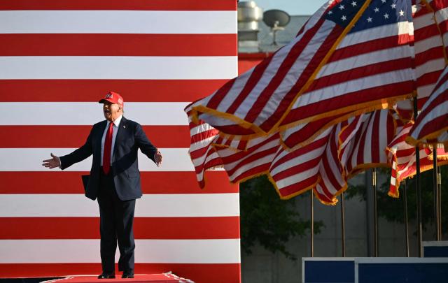 US President Donald Trump steps on stage to deliver remarks at the Salute to America Celebration at the Iowa State Fairgrounds in Des Moines on July 3, 2025. (Photo by ANDREW CABALLERO-REYNOLDS / AFP)
