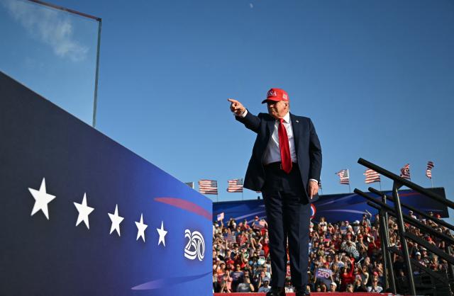 US President Donald Trump gestures as he steps on stage to deliver remarks at the Salute to America Celebration at the Iowa State Fairgrounds in Des Moines on July 3, 2025. (Photo by ANDREW CABALLERO-REYNOLDS / AFP)