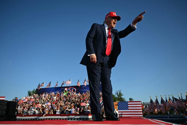 US President Donald Trump gestures as he steps on stage to deliver remarks at the Salute to America Celebration at the Iowa State Fairgrounds in Des Moines on July 3, 2025. (Photo by ANDREW CABALLERO-REYNOLDS / AFP)