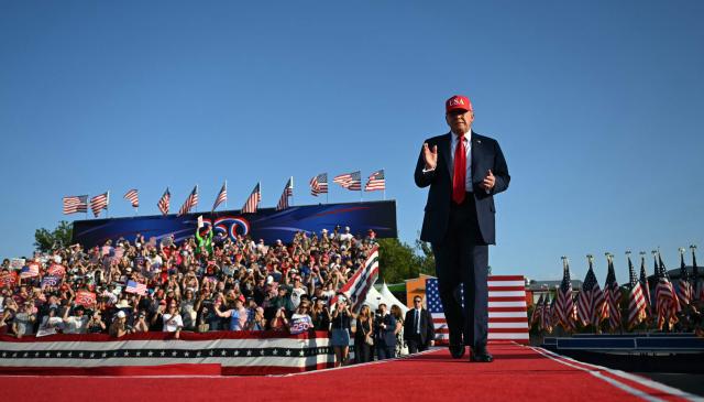 US President Donald Trump gestures as he steps on stage to deliver remarks at the Salute to America Celebration at the Iowa State Fairgrounds in Des Moines on July 3, 2025. (Photo by ANDREW CABALLERO-REYNOLDS / AFP)