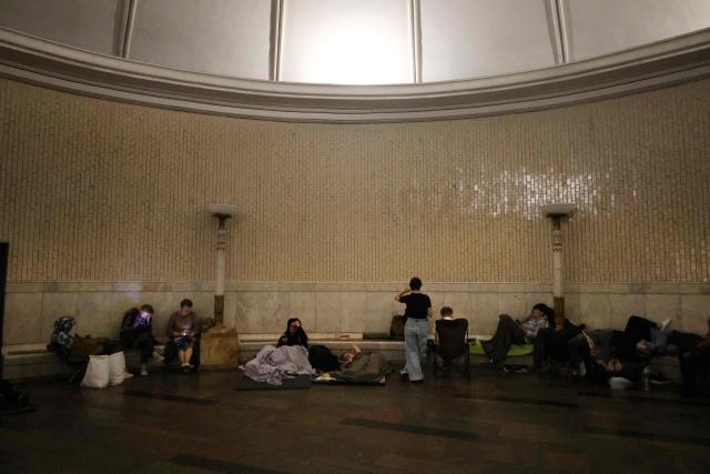 People take shelter over night in an underground subway station during missile strikes in Kyiv on July 4, 2025, amid the Russian invasion of Ukraine. US President Donald Trump said he made no progress with Vladimir Putin on ending the Ukraine war in a call on July 3, as the Kremlin insisted the Russian president would stick to his aims in the conflict. (Photo by Barbara WOJAZER / AFP)