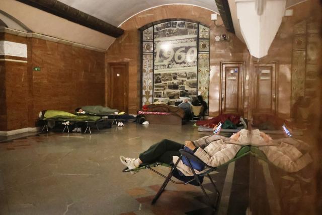 People take shelter over night in an underground subway station during missile strikes in Kyiv on July 4, 2025, amid the Russian invasion of Ukraine. US President Donald Trump said he made no progress with Vladimir Putin on ending the Ukraine war in a call on July 3, as the Kremlin insisted the Russian president would stick to his aims in the conflict. (Photo by Barbara WOJAZER / AFP)