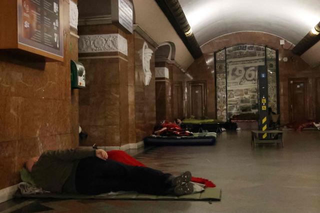 People take shelter over night in an underground subway station during missile strikes in Kyiv on July 4, 2025, amid the Russian invasion of Ukraine. US President Donald Trump said he made no progress with Vladimir Putin on ending the Ukraine war in a call on July 3, as the Kremlin insisted the Russian president would stick to his aims in the conflict. (Photo by Barbara WOJAZER / AFP)