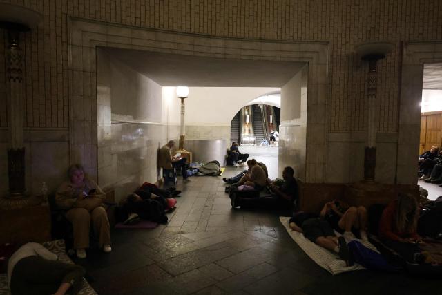 People take shelter over night in an underground subway station during missile strikes in Kyiv on July 4, 2025, amid the Russian invasion of Ukraine. US President Donald Trump said he made no progress with Vladimir Putin on ending the Ukraine war in a call on July 3, as the Kremlin insisted the Russian president would stick to his aims in the conflict. (Photo by Barbara WOJAZER / AFP)