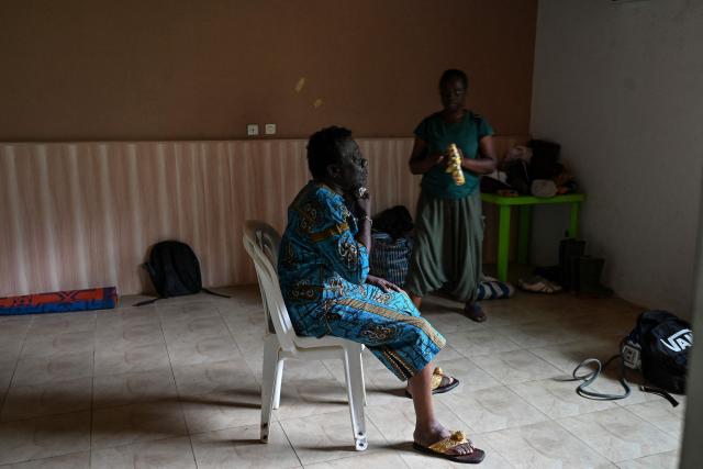 Actors prepare on the set of "Le Testament", directed by Burkina's Adama Rouamba, in a village near Agboville on June 27, 2025. In the shadow of Nigeria's towering Nollywood and its prolific productions, Ivory Coast has been striving to establish itself as an attractive destination for filmmaking on the African continent. (Photo by Issouf SANOGO / AFP)