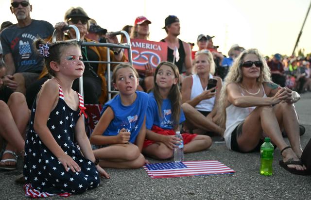 Supporters and children listen to US President Donald Trump’s address during the Salute to America celebration at the Iowa State Fairgrounds in Des Moines on July 3, 2025. (Photo by ANDREW CABALLERO-REYNOLDS / AFP)