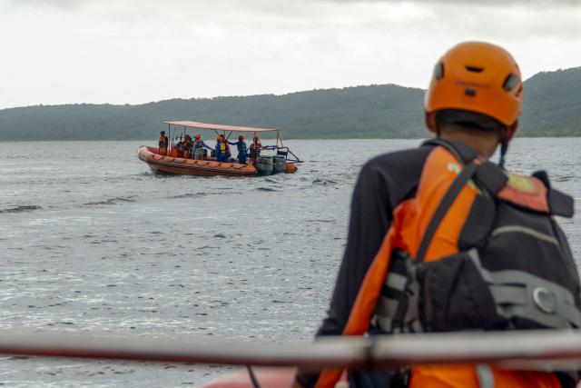Rescuers search for missing victims of a ferry accident in the waters off the Bali Strait in Jembrana, Bali, on July 4, 2025. At least six people were dead and dozens unaccounted after a ferry sank in rough seas on its way to the Indonesian resort island Bali, according to rescue authorities who said 29 survivors had been plucked from the water so far. (Photo by Dicky Bisinglasi / AFP)