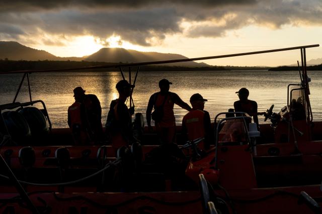 Rescuers search for missing victims of a ferry accident in the waters off the Bali Strait in Jembrana, Bali, on July 4, 2025. At least six people were dead and dozens unaccounted after a ferry sank in rough seas on its way to the Indonesian resort island Bali, according to rescue authorities who said 29 survivors had been plucked from the water so far. (Photo by Dicky Bisinglasi / AFP)