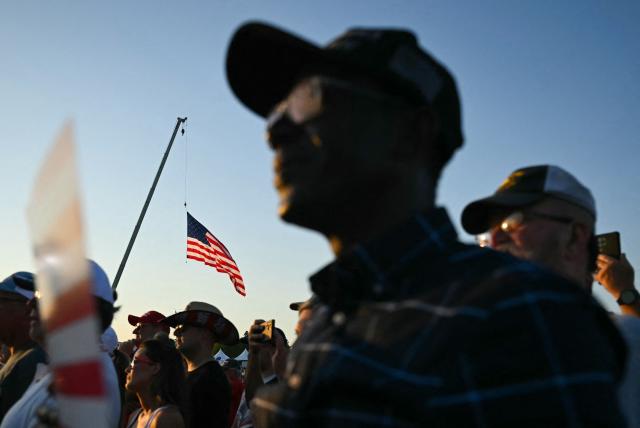 Supporters listen to US President Donald Trump speak during the Salute to America celebration at the Iowa State Fairgrounds in Des Moines on July 3, 2025. (Photo by ANDREW CABALLERO-REYNOLDS / AFP)