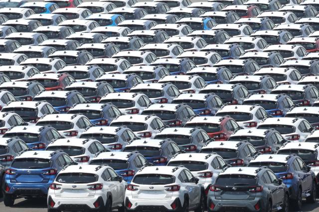 This photo taken on April 17, 2025 shows new cars lined up at a pier in Yokohama, Kanagawa prefecture, south of Tokyo. US President Donald Trump said on July 1 a trade deal with Japan was unlikely before the July 9 deadline, threatening to raise tariffs on Japanese imports to 30 or 35 percent. (Photo by JIJI Press / AFP) / Japan OUT