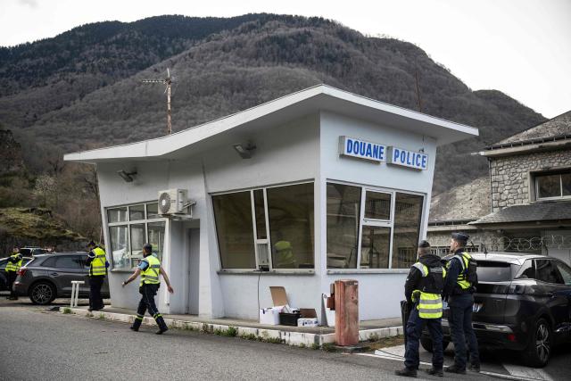 (FILES) French gendarmes check drivers crossing the French-Spanish border at the customs post in Fos, southern France, on March 19, 2025, during a control operation against drug trafficking, illegal immigration and the illegal importation of cigarettes and alcohol. On the A9 motorway, which runs along the Mediterranean coast from Spain, Narbonne customs officers, flashing their lights and blaring their sirens, pull over suspicious vehicles in search of cocaine traffickers who are increasingly crossing the Franco-Spanish border, where more than 65 percent of the drugs supplying France already transit. (Photo by Lionel BONAVENTURE / AFP)