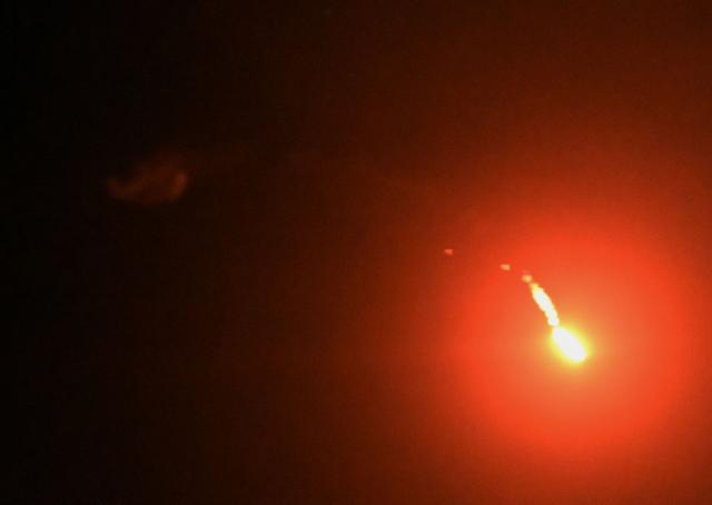 A Russian drone is shot down by Ukrainian air defences during a night mass strike on Kyiv on July 4, 2025, amid the Russian invasion of Ukraine. (Photo by Sergei SUPINSKY / AFP)