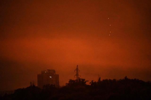 The Ukrainian air defence fires at Russian drones during a night mass strike on Kyiv on July 4, 2025, amid the Russian invasion of Ukraine. (Photo by Sergei SUPINSKY / AFP)
