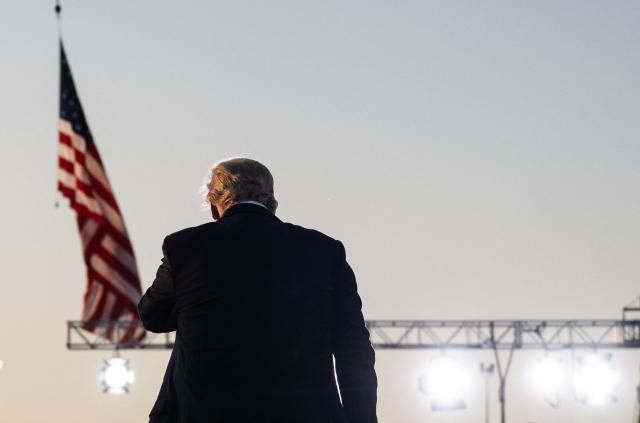 US President Donald Trump takes off his hat as he leaves the stage after speaking at the Salute to America Celebration at the Iowa State Fairgrounds in Des Moines on July 3, 2025. (Photo by ANDREW CABALLERO-REYNOLDS / AFP)