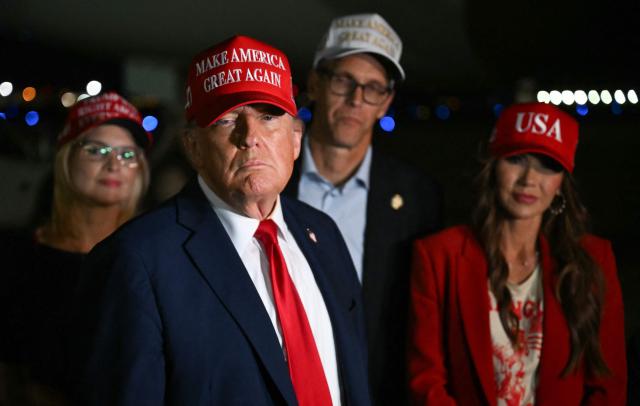 US President Donald Trump talks to journalists as he arrives at Joint Base Andrews, Maryland on July 3, 2025. Trump returns from Iowa where he spoke at the Salute to America Celebration at the Iowa State Fairgrounds in Des Moines. (Photo by ANDREW CABALLERO-REYNOLDS / AFP)