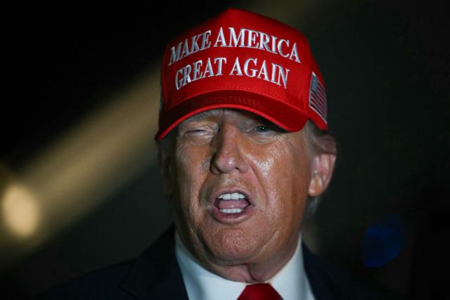 US President Donald Trump talks to journalists as he arrives at Joint Base Andrews, Maryland early on July 4, 2025. Trump returns from Iowa where he spoke at the Salute to America Celebration at the Iowa State Fairgrounds in Des Moines. (Photo by ANDREW CABALLERO-REYNOLDS / AFP)