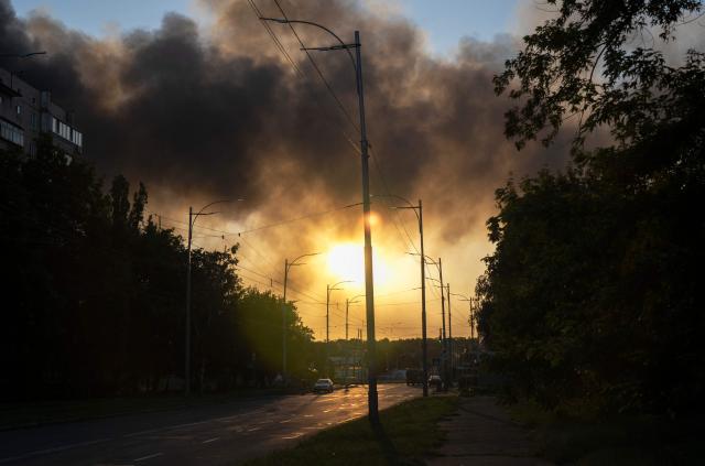 Smoke rises over Kyiv following mass Russian drones and missile strikes on the Ukraine's capital on July 4, 2025, amid the Russian invasion of Ukraine. Ukraine said Russia had launched 550 drones and missiles at the war-battered country overnight, as the Kremlin steps up aerial attacks and US-led peace talks stall. The Ukrainian air force said Moscow had launched 539 drones and 11 missiles, adding that air defence units had downed 268 drones and two missiles. (Photo by OLEKSII FILIPPOV / AFP)