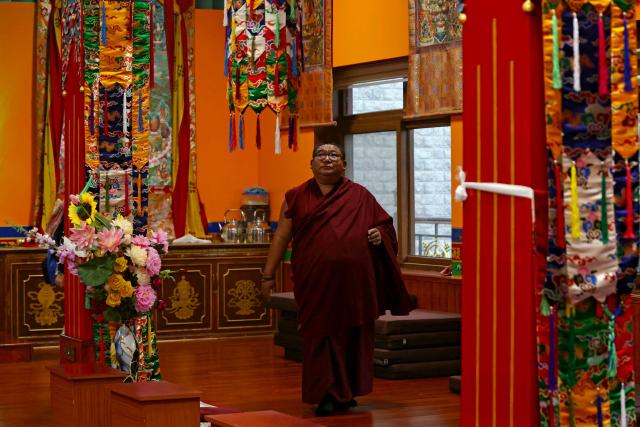 A Buddhist monk walks at Nechung Monastery in McLeodganj on July 4, 2025. (Photo by Niharika KULKARNI / AFP)
