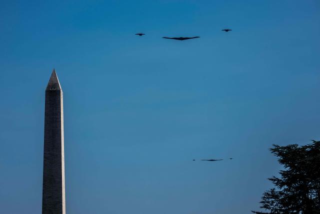 Two B-2 Spirit stealth bombers, escorted by fighter jets, flies past the Washington monument after a flyover at the White House in Washington, DC, on July 4, 2025. (Photo by Jim WATSON / AFP)