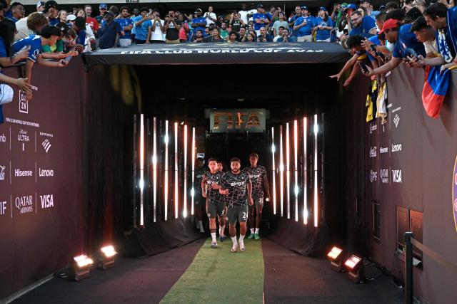 Chelsea's Argentinian midfielder #08 Enzo Fernandez, English defender #24 Reece James and English defender #23 Trevoh Chalobah walk onto the pitch for a warm up ahead of the FIFA Club World Cup 2025 quarterfinal football match between Brazil's Palmeiras and England's Chelsea at the Lincoln Financial Field Stadium in Philadelphia on July 4, 2025. (Photo by Juan MABROMATA / AFP)
