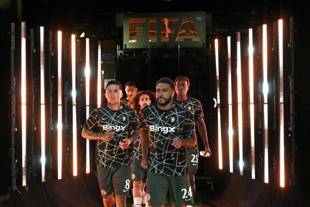 Chelsea's players walk onto the pitch for a warm up ahead of the FIFA Club World Cup 2025 quarterfinal football match between Brazil's Palmeiras and England's Chelsea at the Lincoln Financial Field Stadium in Philadelphia on July 4, 2025. (Photo by JUAN MABROMATA / AFP)