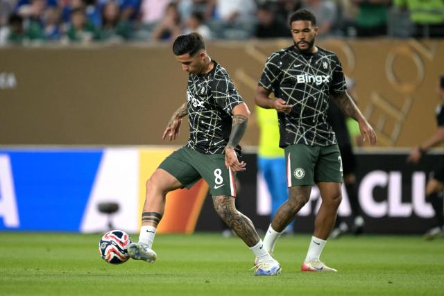 Chelsea's Argentinian midfielder #08 Enzo Fernandez (L) and Chelsea's English defender #24 Reece James (R) warm up ahead of the FIFA Club World Cup 2025 quarterfinal football match between Brazil's Palmeiras and England's Chelsea at the Lincoln Financial Field Stadium in Philadelphia on July 4, 2025. (Photo by Juan MABROMATA / AFP)