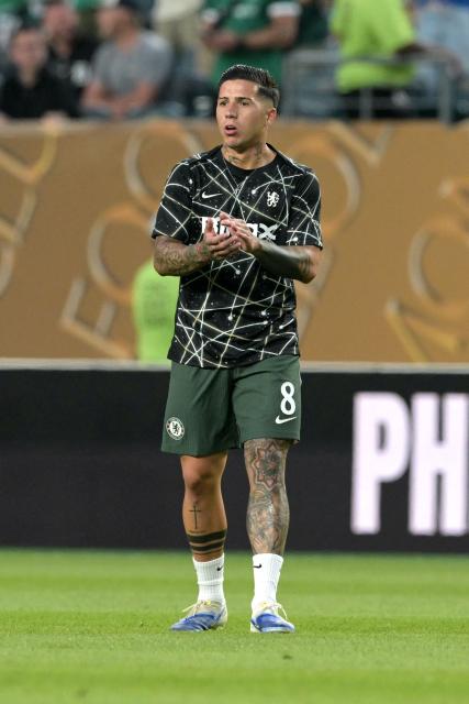 Chelsea's Argentinian midfielder #08 Enzo Fernandez warms up ahead of the FIFA Club World Cup 2025 quarterfinal football match between Brazil's Palmeiras and England's Chelsea at the Lincoln Financial Field Stadium in Philadelphia on July 4, 2025. (Photo by Juan MABROMATA / AFP)