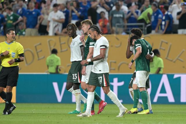 Chelsea's Brazilian midfielder #17 Andrey Santos (2nd-R) speaks to Palmeiras' Argentine defender #04 Agustin Giay (R) after Palmeiras' own goal during the FIFA Club World Cup 2025 quarterfinal football match between Brazil's Palmeiras and England's Chelsea at the Lincoln Financial Field Stadium in Philadelphia on July 4, 2025. (Photo by JUAN MABROMATA / AFP)